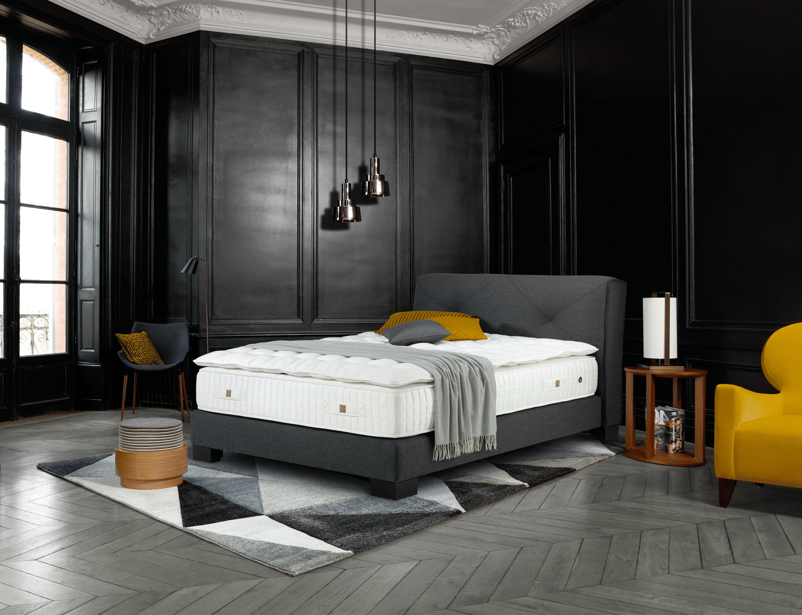 Elegant Treca Paris bed with luxury mattress in a refined contemporary bedroom setting.